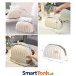 tissue holder, often called a shell or bread-style box, features a cream-colored ribbed design with a small pink bow