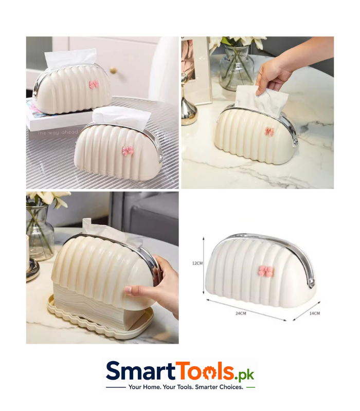 tissue holder, often called a shell or bread-style box, features a cream-colored ribbed design with a small pink bow tissue holder, often called a shell or bread-style box, features a cream-colored ribbed design with a small pink bow